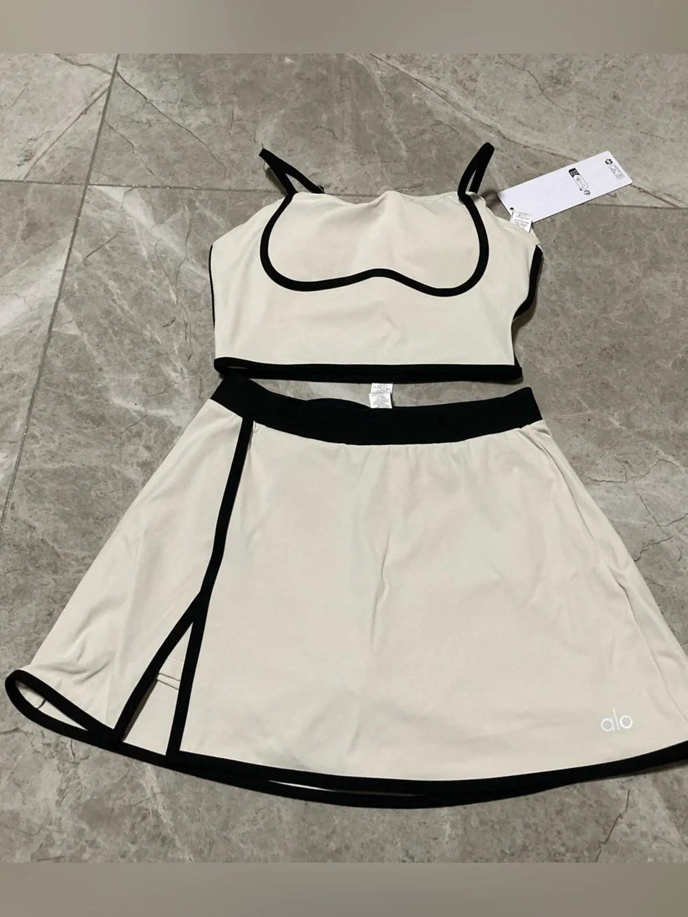 ALO Yoga Cream Two-Piece Crop Top and Skirt with Black Trim